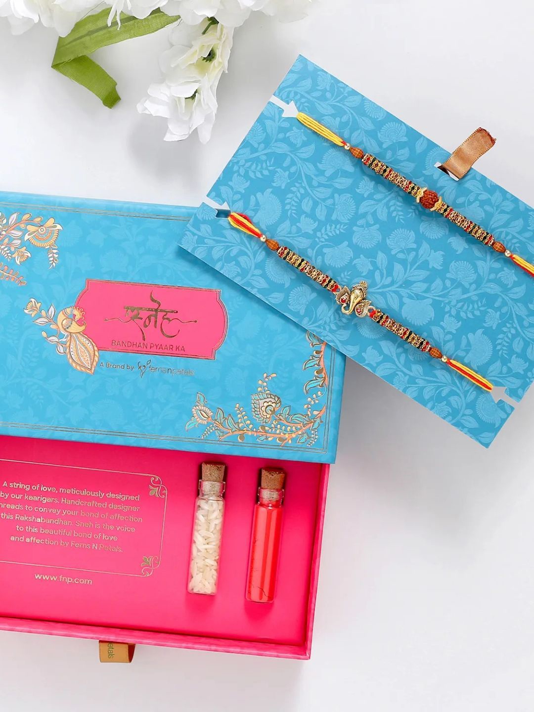 

fnp Auspicious Ganesha and Rudraksha Rakhi Set Bracelet Rakhis, Gold
