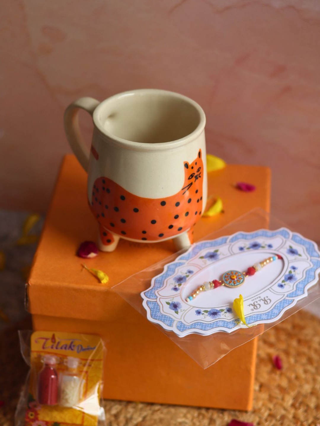 

WEAVING HOMES Rakhi With Mug Roli Chawal, Gold