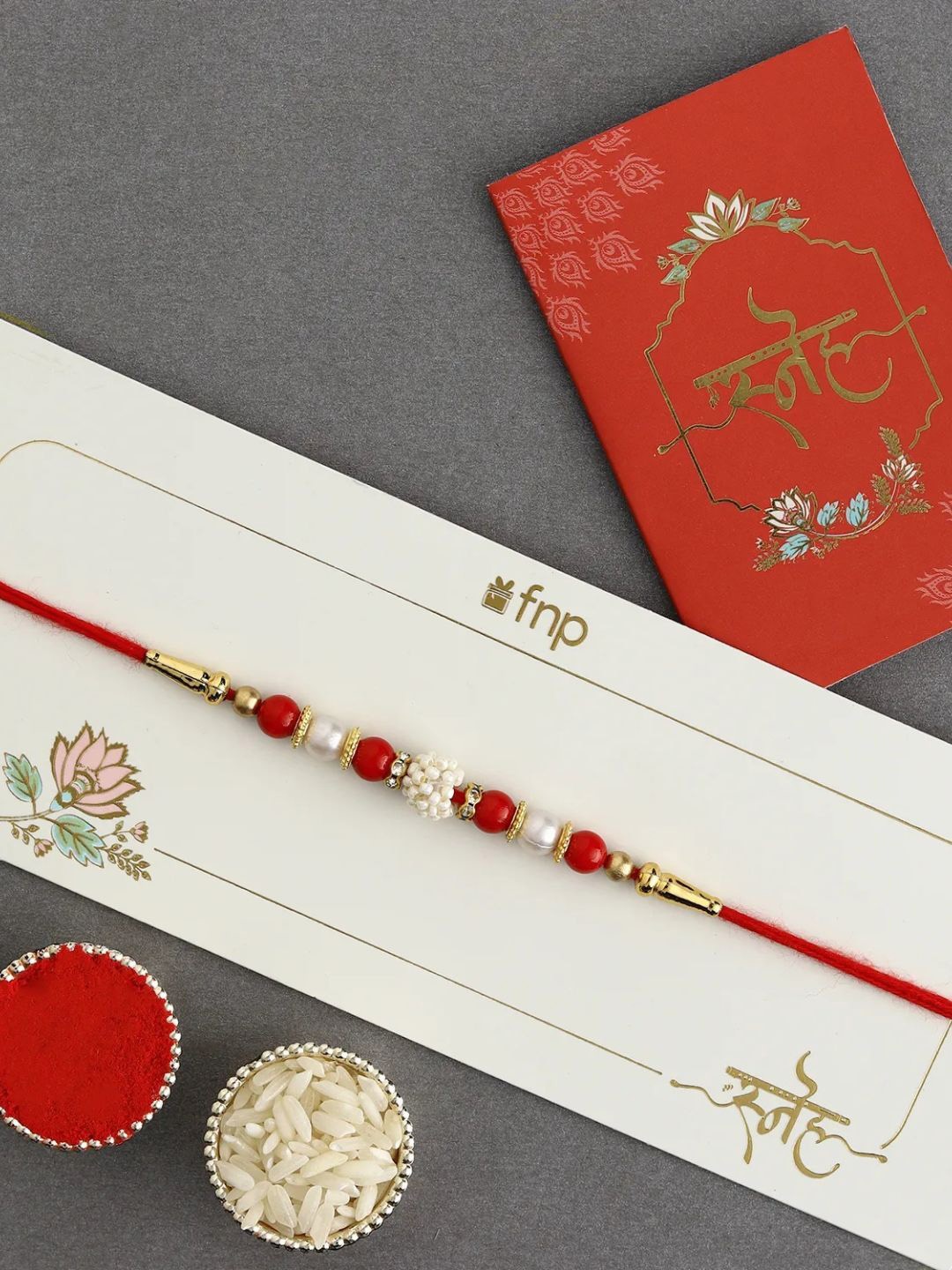 

fnp Luminescent Luster Pearl Rakhi Bracelet Rakhis, Red