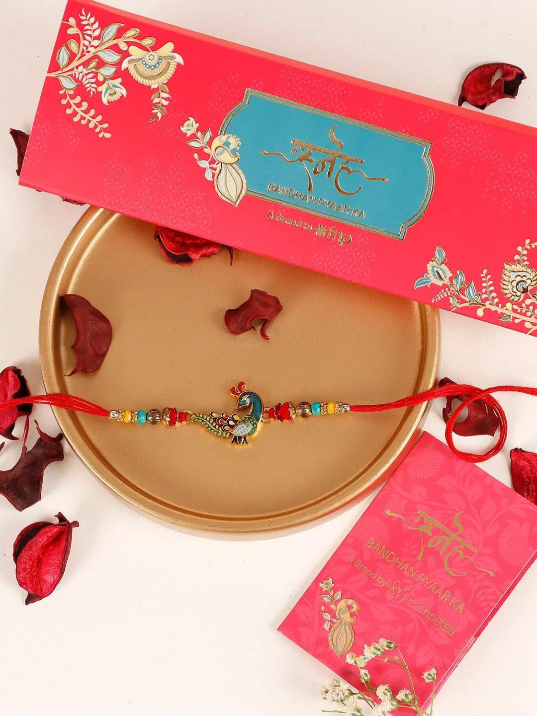 

fnp Meenakari Peacock Rakhi Classic Pearls, Red