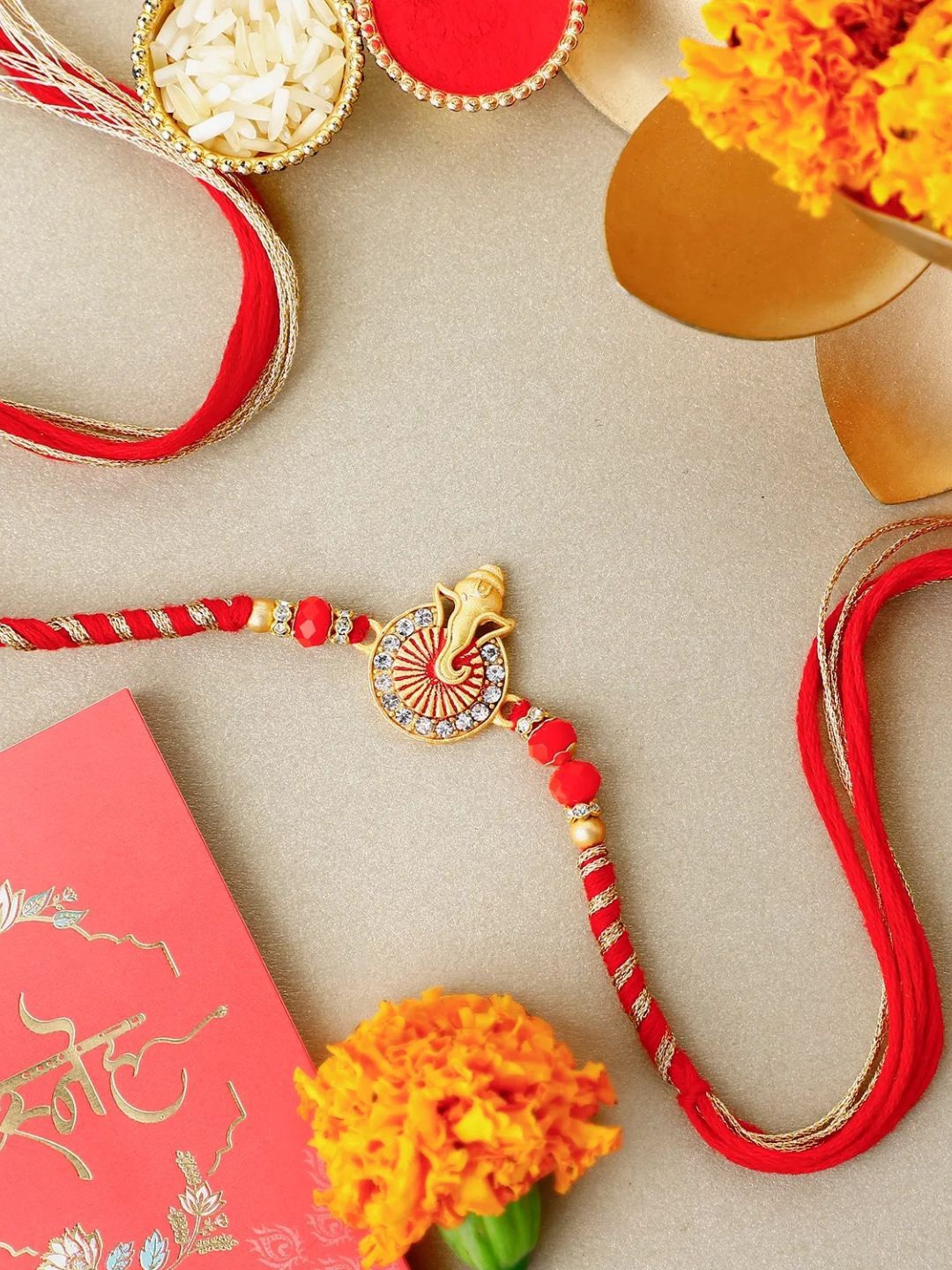 

fnp Ethereal Ganesha Harmony Rakhi Classic Pearls, Red