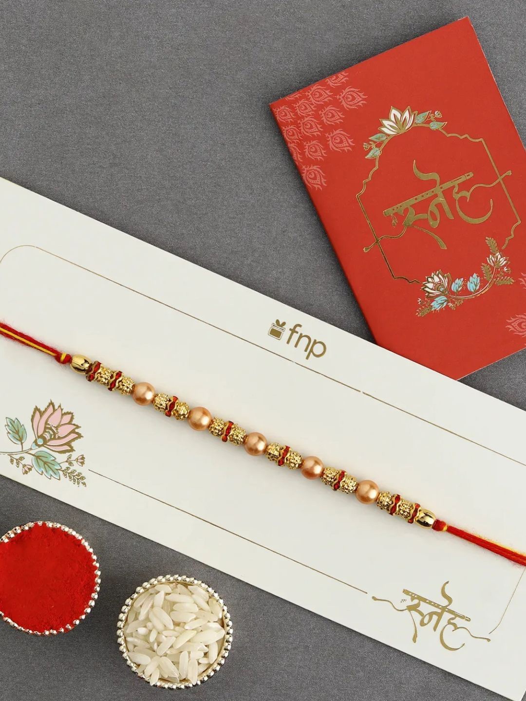 

fnp Celestial Beads Serenade Rakhi Traditional Kundan, Gold