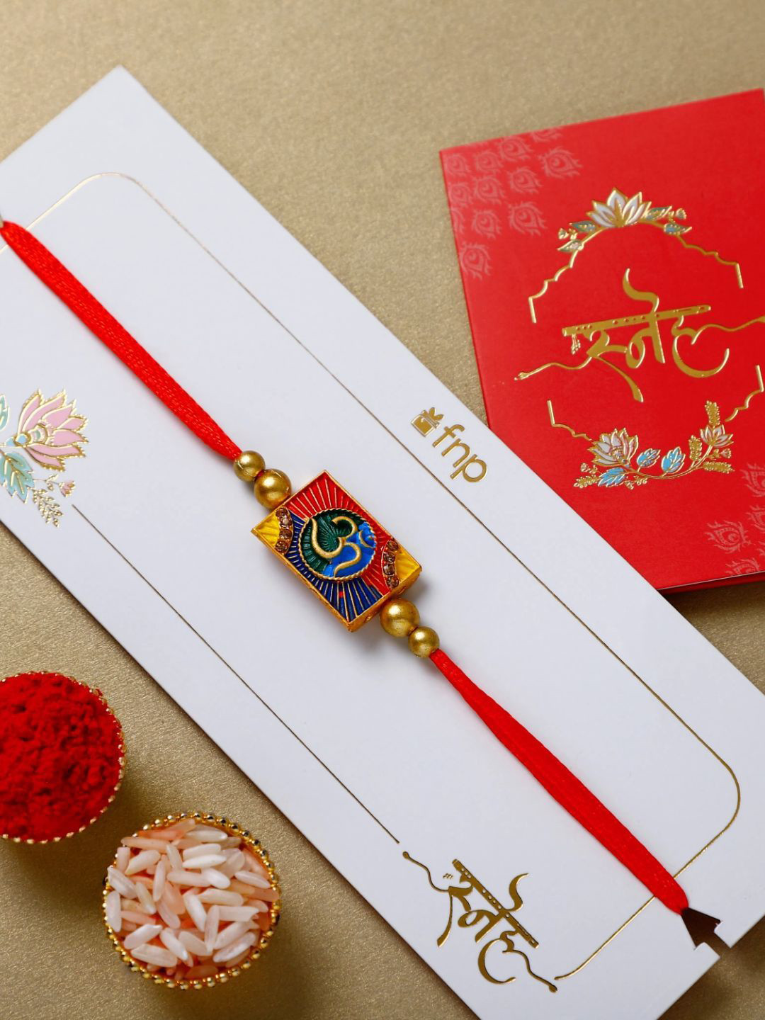 

fnp Eternal Om Blessing Rakhi Magical Evil Eye, Red