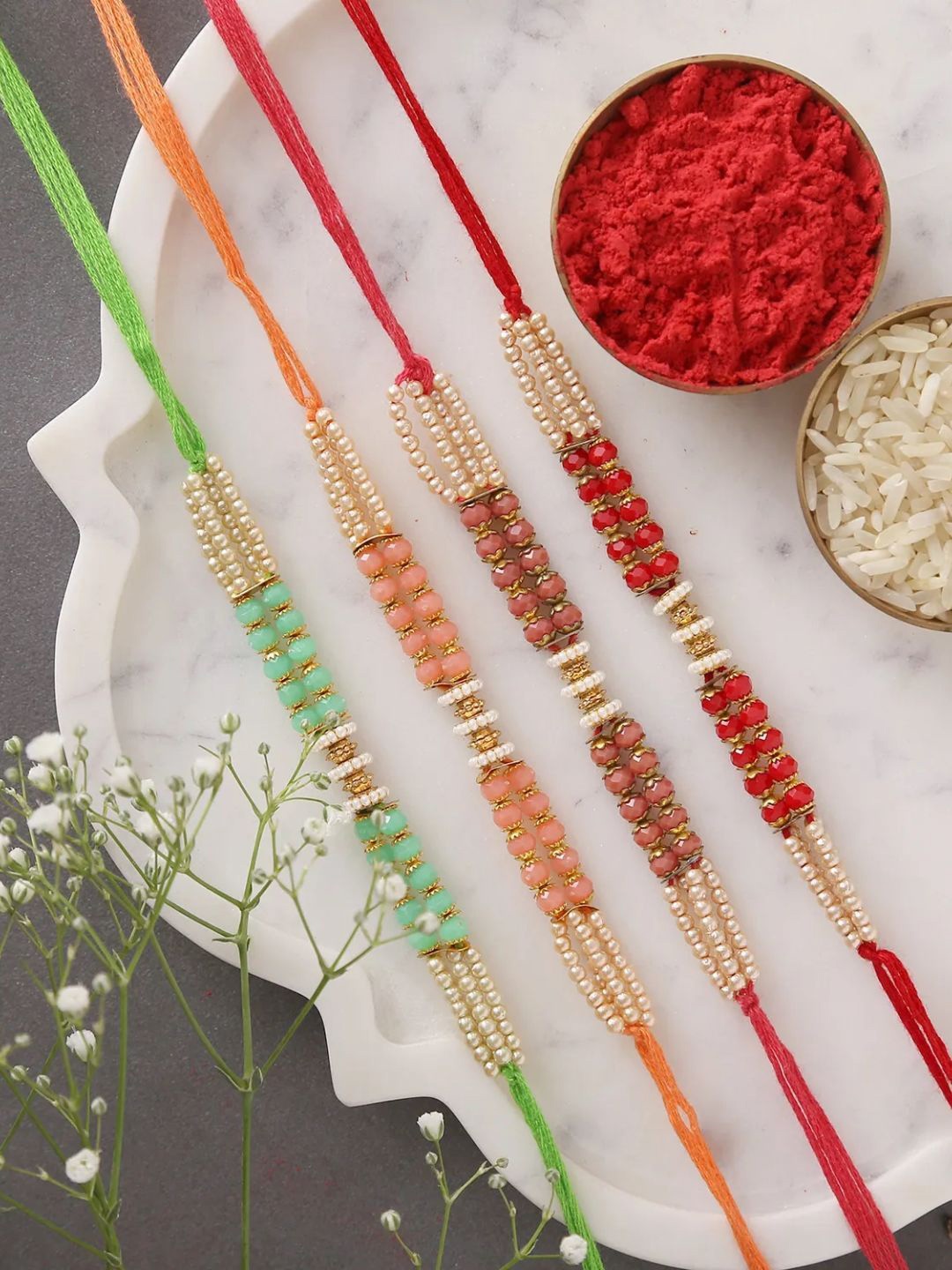 

fnp Sneh Traditional Beads Rakhis Set of 4 Magical Evil Eye, Green