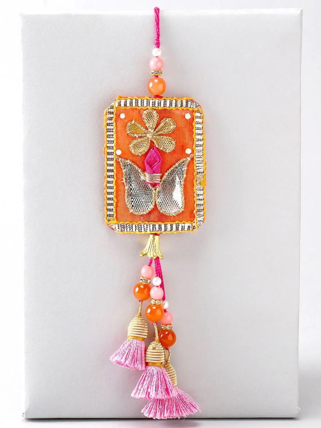 

fnp Bright Lumba Designer Rakhi Mauli Rakhis, Orange