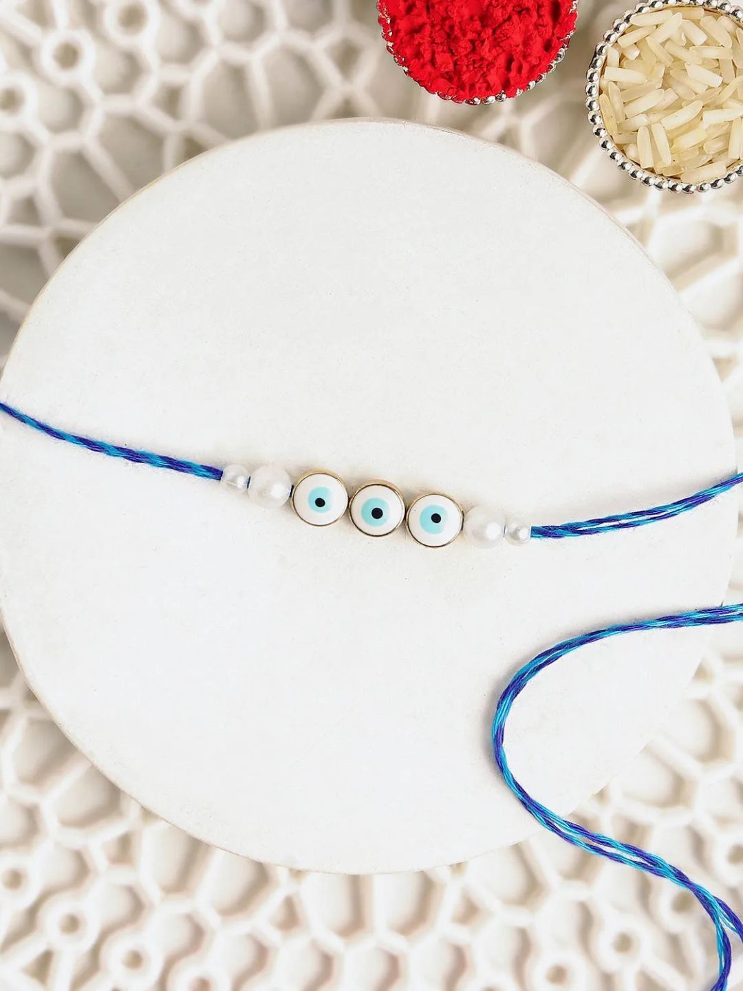

fnp Simplistic Blue Evil Eye Rakhi Bracelet Rakhis