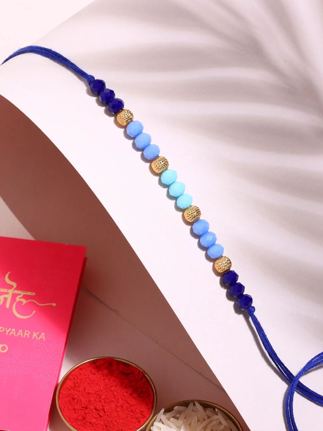 

fnp Tranquil Harmony Beads Rakhi Lumba Rakhis, Blue