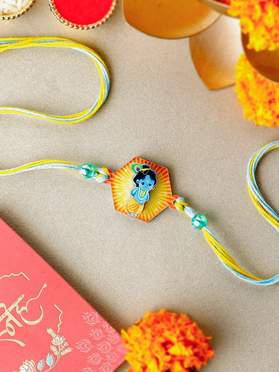 

fnp Enchanting Love in 3D Krishna Rakhi American Diamond, Yellow