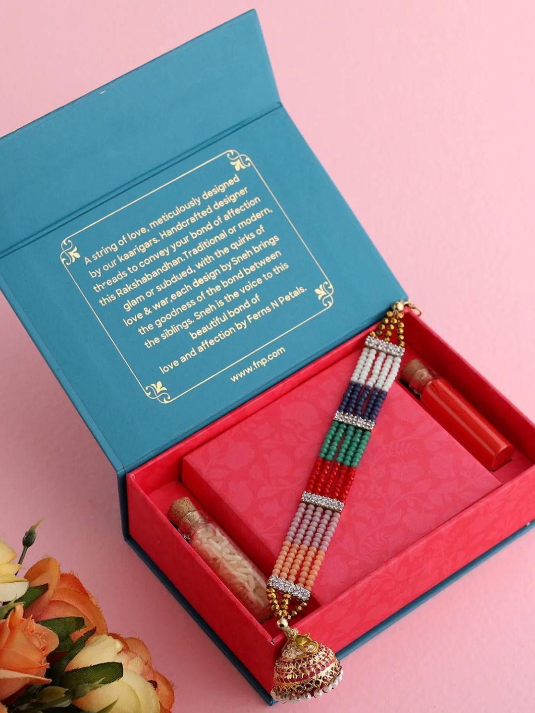 

fnp Classy Multicoloured Lumba Rakhi Bhaiya-Bhabhi Rakhis, Red