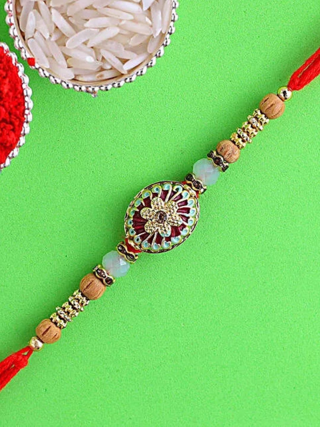 

fnp Sneh Blessings of Rudraksha Rakhi Bhaiya-Bhabhi Rakhis, Gold