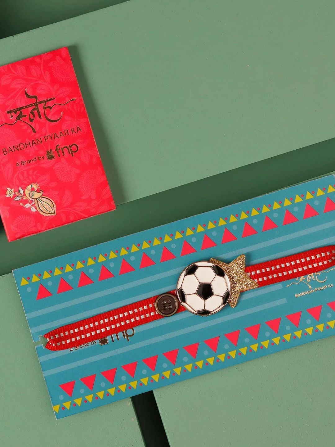 

fnp Star Striker Gold Star Football Rakhi for Kids Traditional Kundan, Red