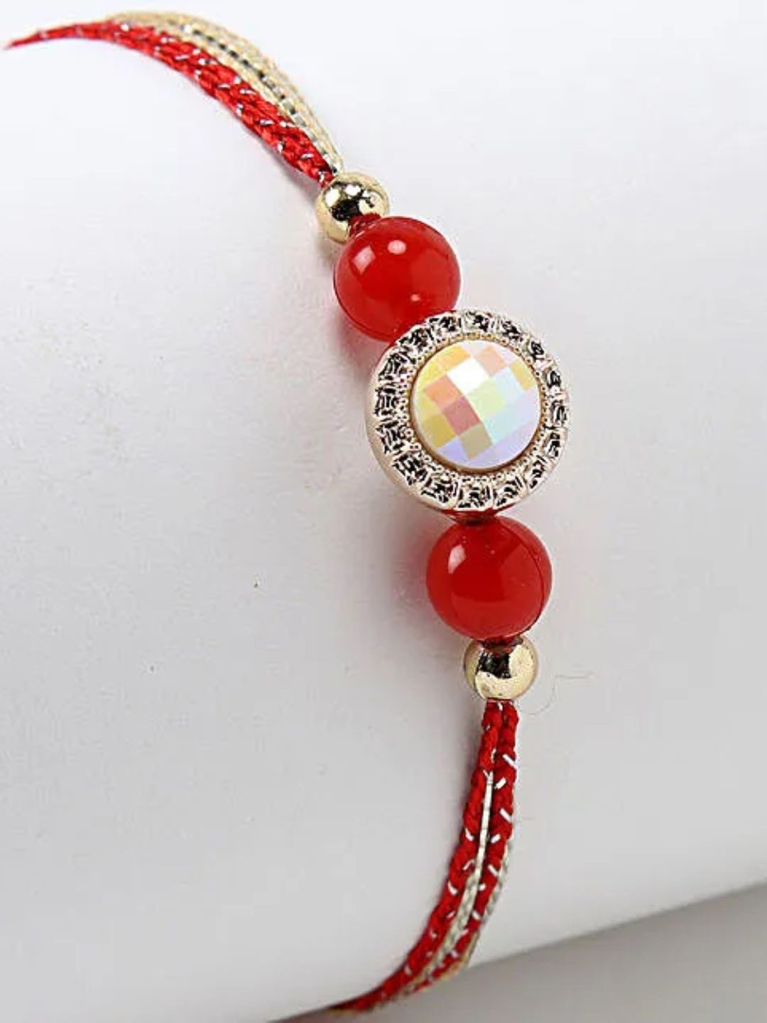 

fnp Sneh Red Pearl Rakhi American Diamond
