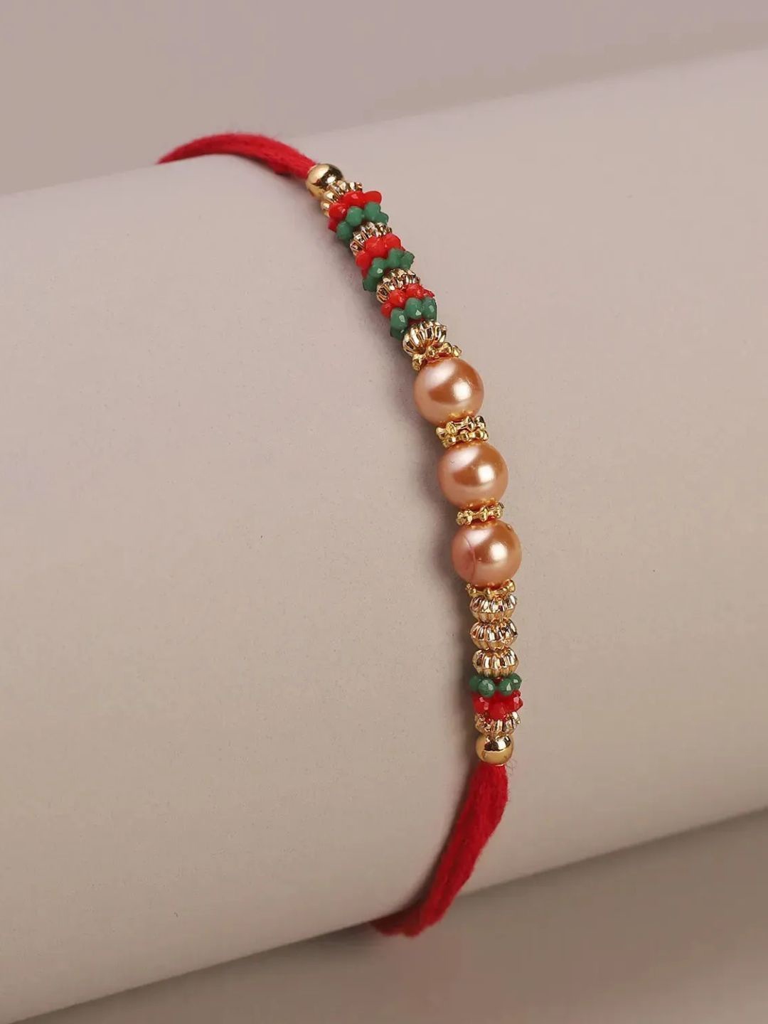 

fnp Starlit Pearls Rakhi Classic Pearls, Red