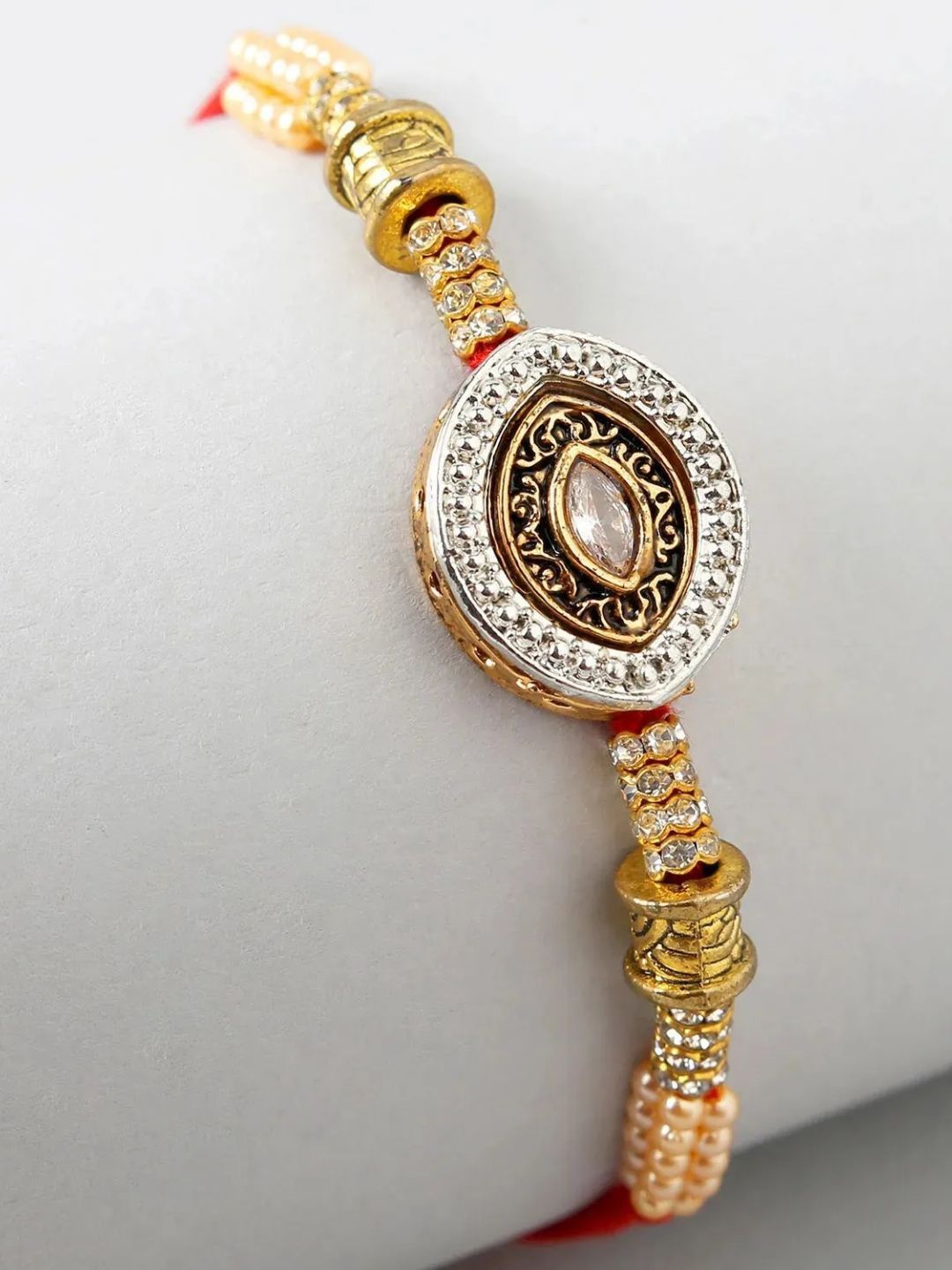 

fnp Regal Pearl Rakhi Bhaiya-Bhabhi Rakhis, Gold