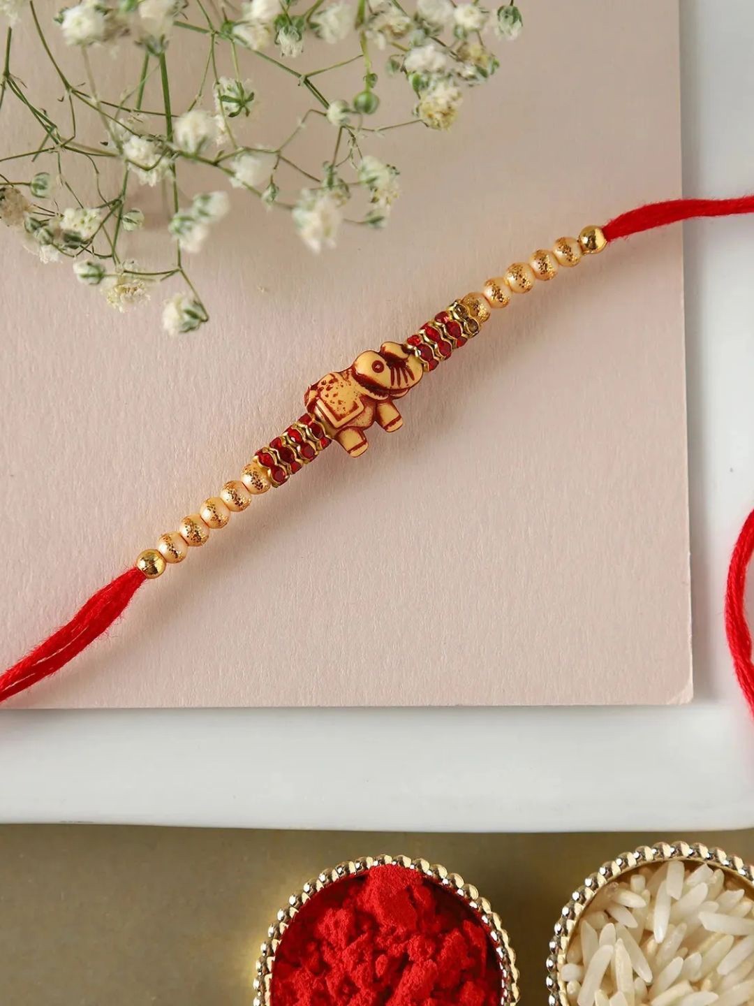 

fnp Sneh Antique Elephant Rakhi American Diamond, Red