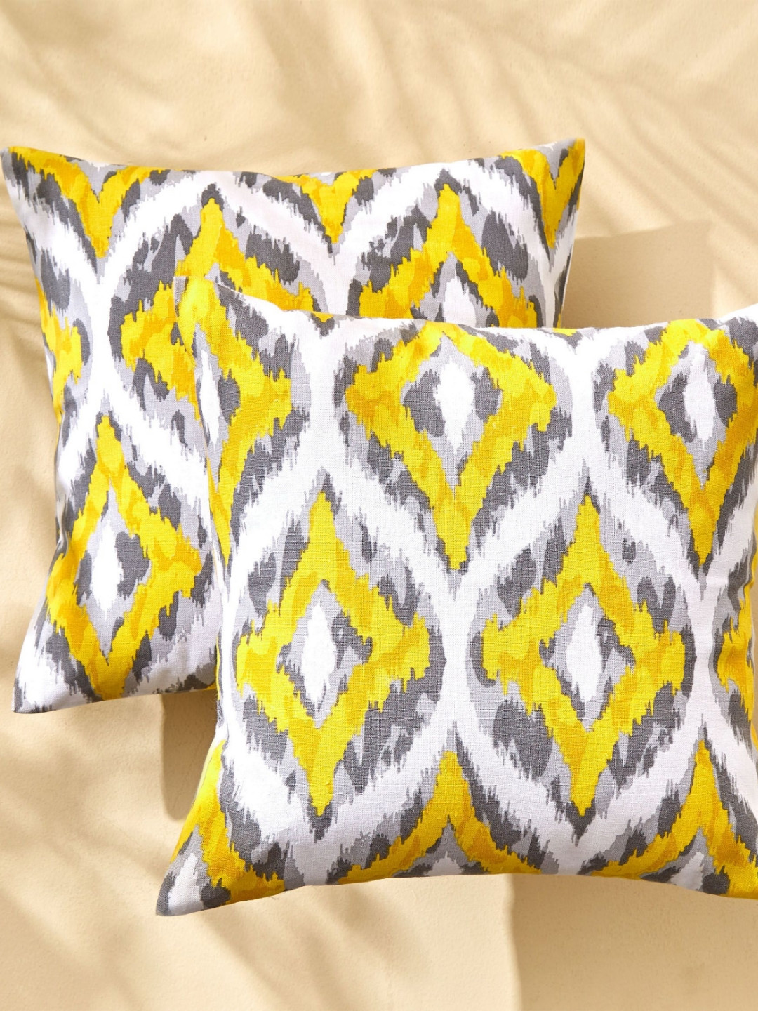 

Home Centre White & Yellow Set of 2 Geometric Square Cushion Covers