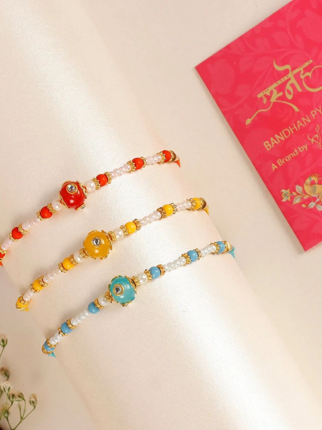 

fnp Sunlit Sea Beads Rakhi Set of 3 Bracelet Rakhis, Red