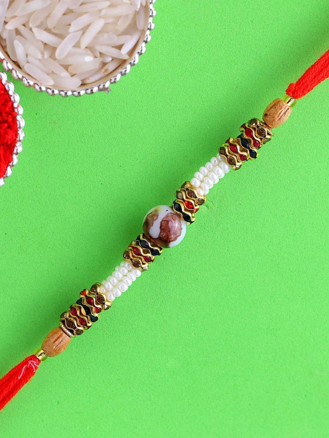 

fnp Striking Pearl Rakhi Mauli Rakhis, White