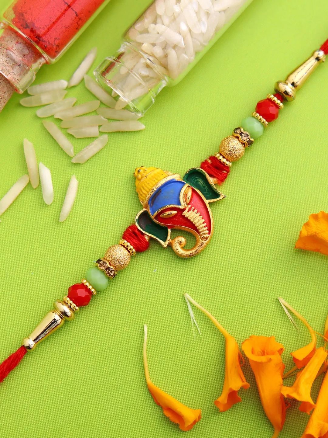 

fnp Divine Lord Ganesha Rakhi Traditional Kundan, Red