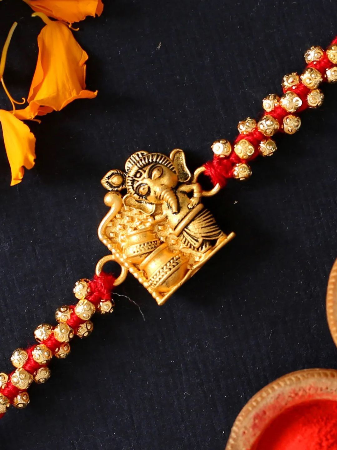

fnp Cute Ganesha Rakhi For Rakshabandhan Magical Evil Eye, Brown