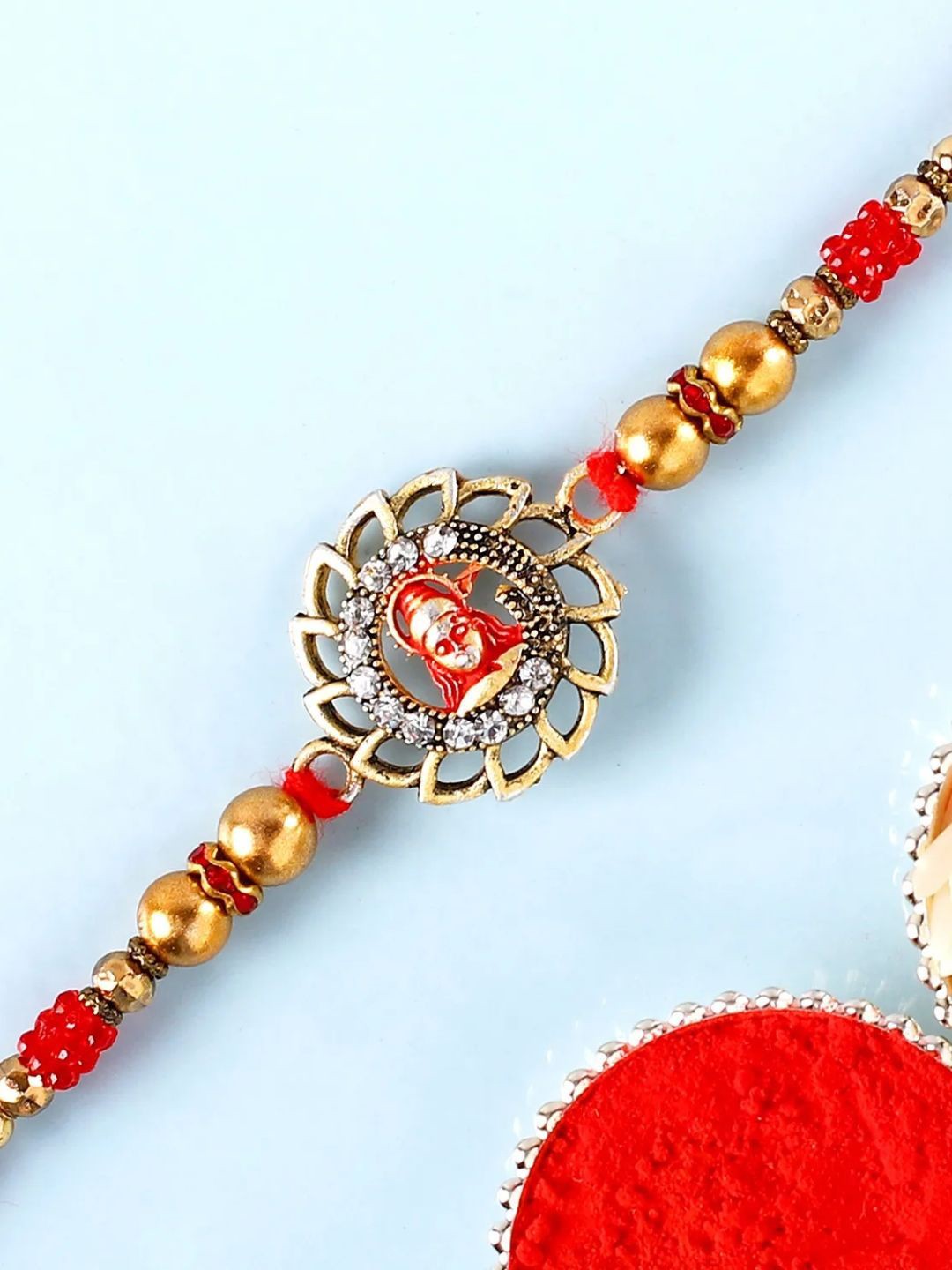 

fnp Auspicious Hanuman Rakhi American Diamond, Gold