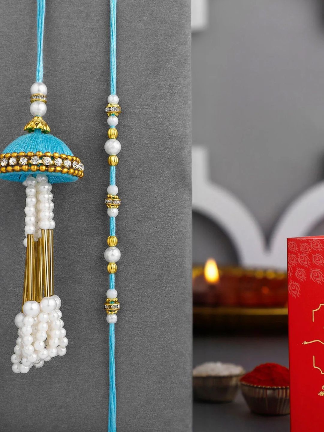 

fnp Tranquil Teal Jhumar Bhaiya Bhabhi Pearl Rakhi Set Kids Collection, Blue