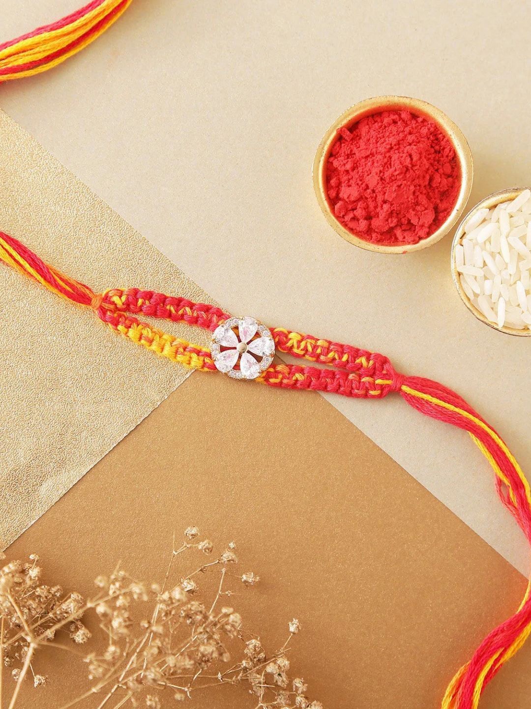 

fnp Sneh Charming Pearl Floral Rakhi Magical Evil Eye, Red