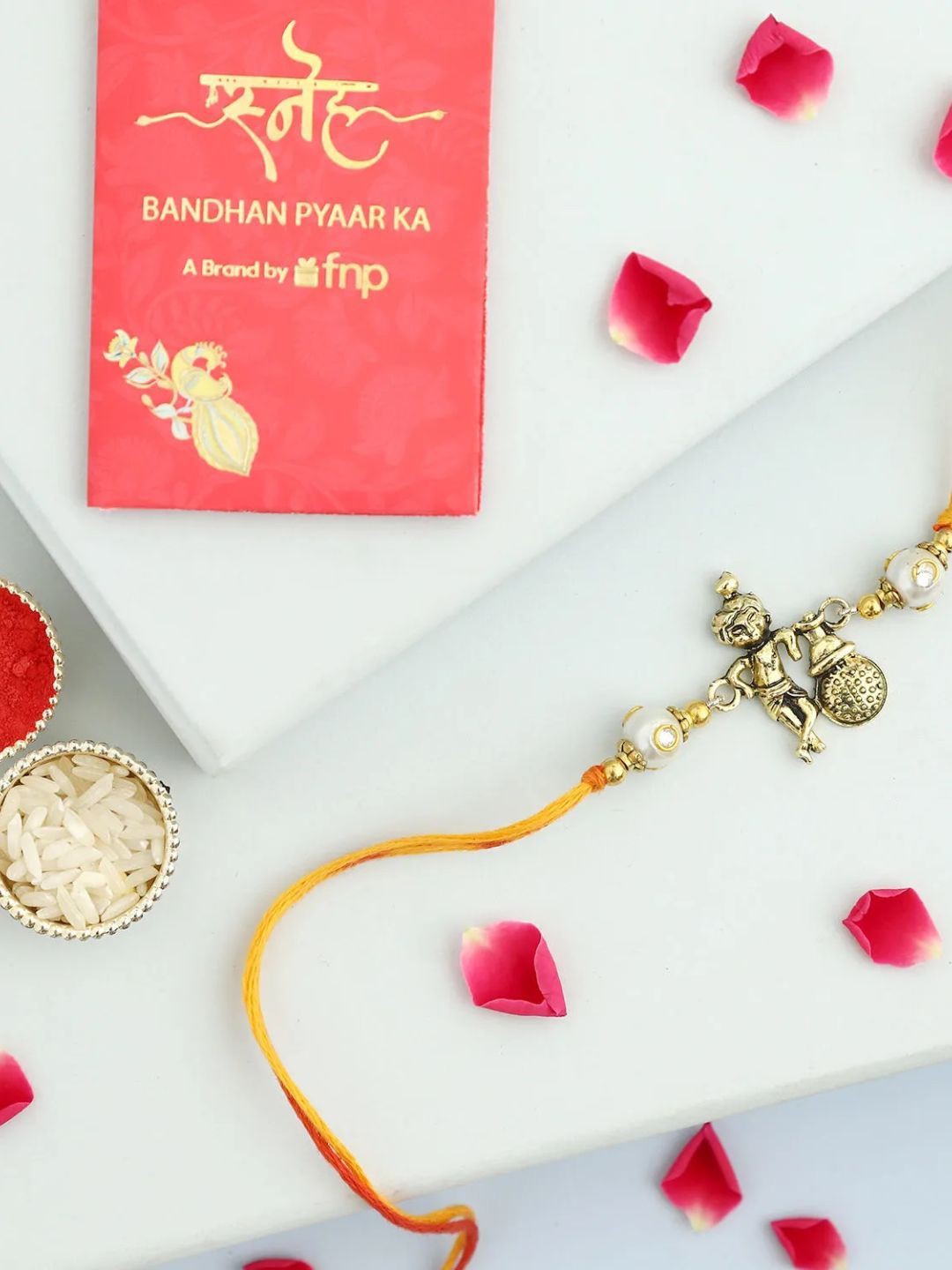 

fnp Joyful Matki Bal Gopal Rakhi Magical Evil Eye, Gold