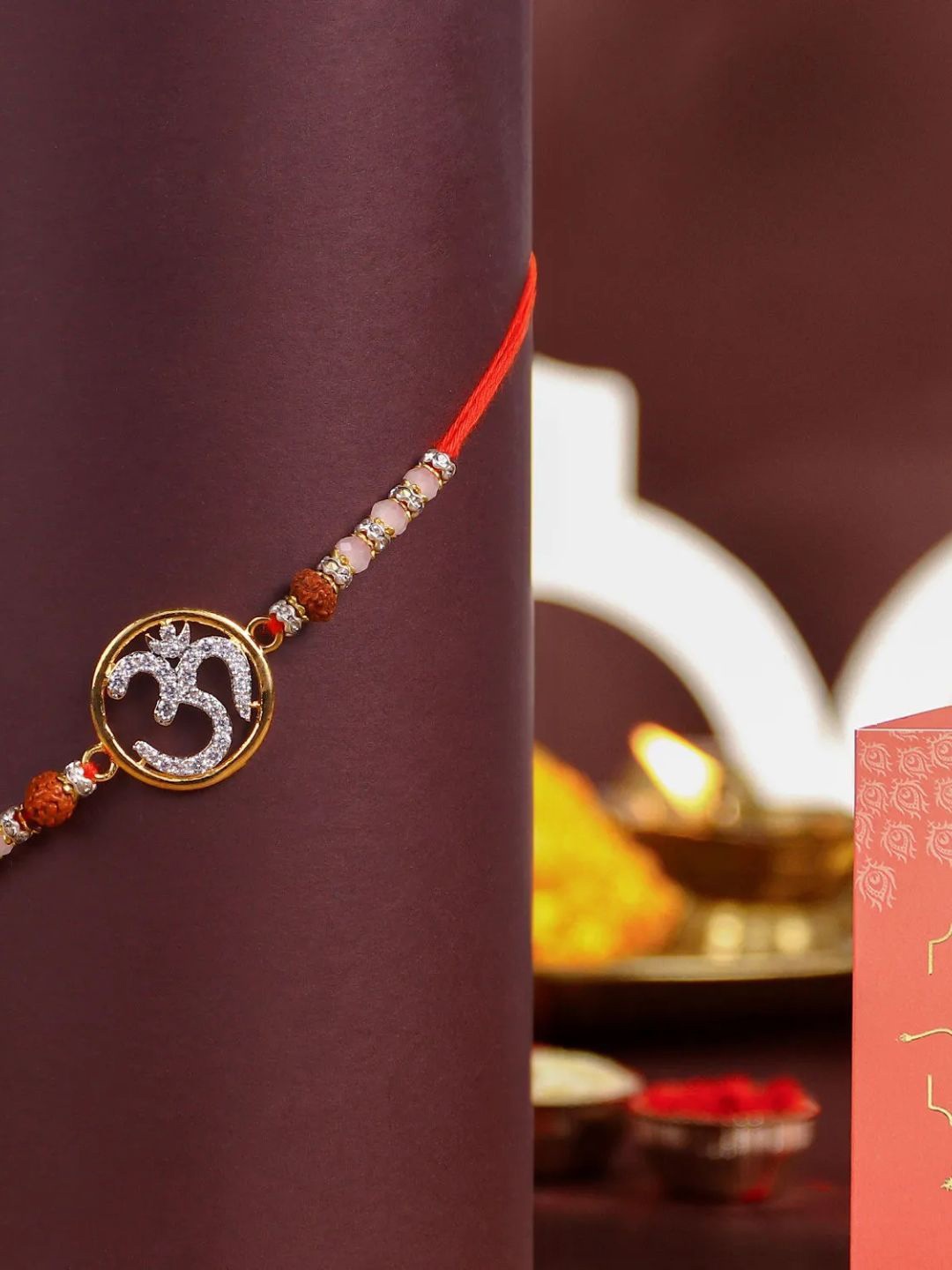 

fnp Eternal Glow Om Rakhi Kids Collection, Red