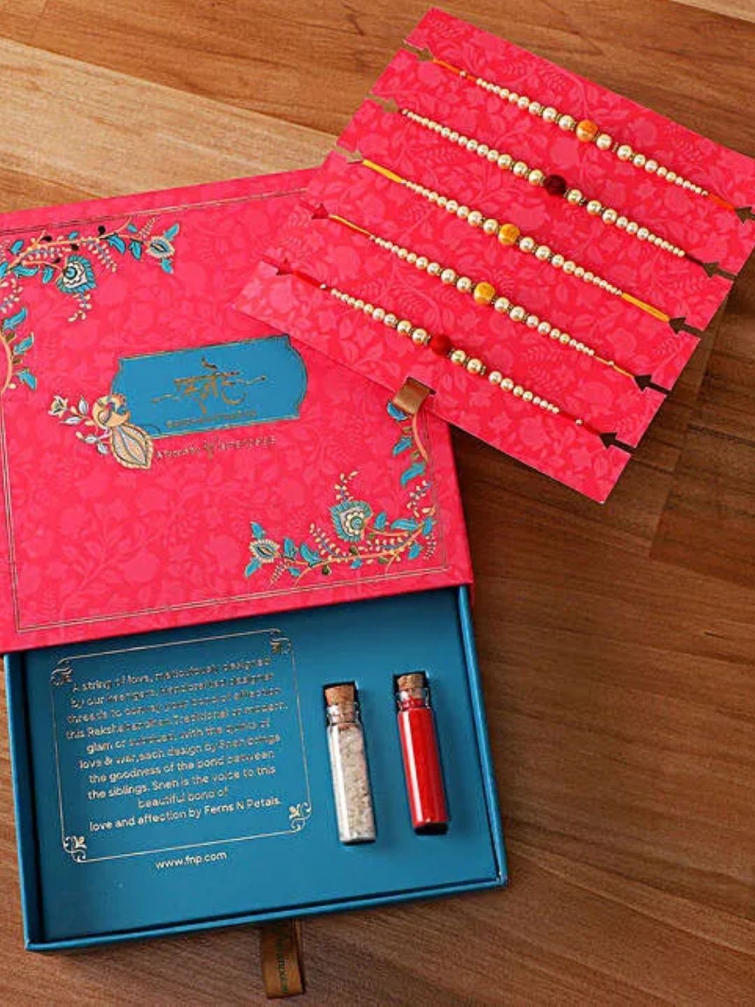 

fnp Sneh Pearl Rakhi Set Bhaiya-Bhabhi Rakhis, Gold