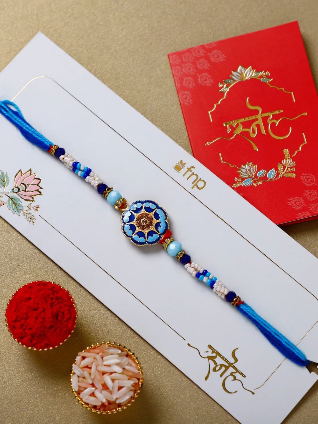 

fnp Floral Blue Meenakari Rakhi Bhaiya-Bhabhi Rakhis