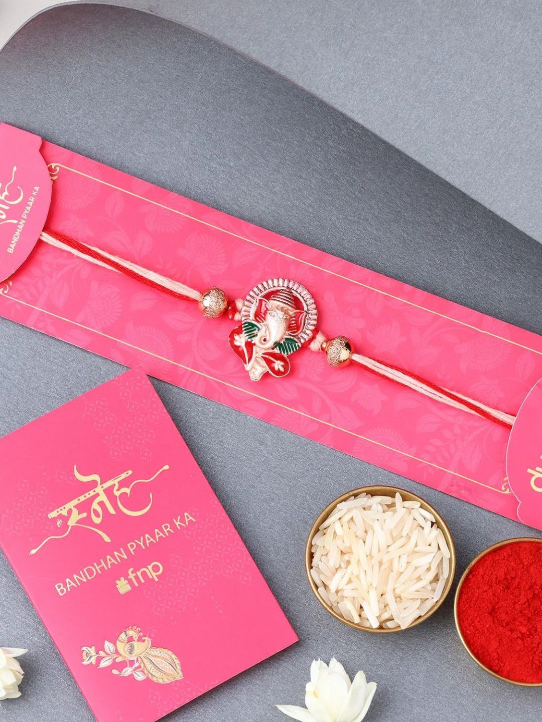 

fnp Lively Pearl Red Lumba Mauli Rakhis, Rose gold