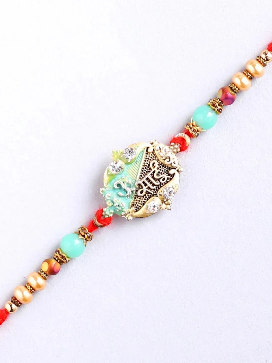 

fnp Celestial Omkar Rakhi Traditional Kundan, Red