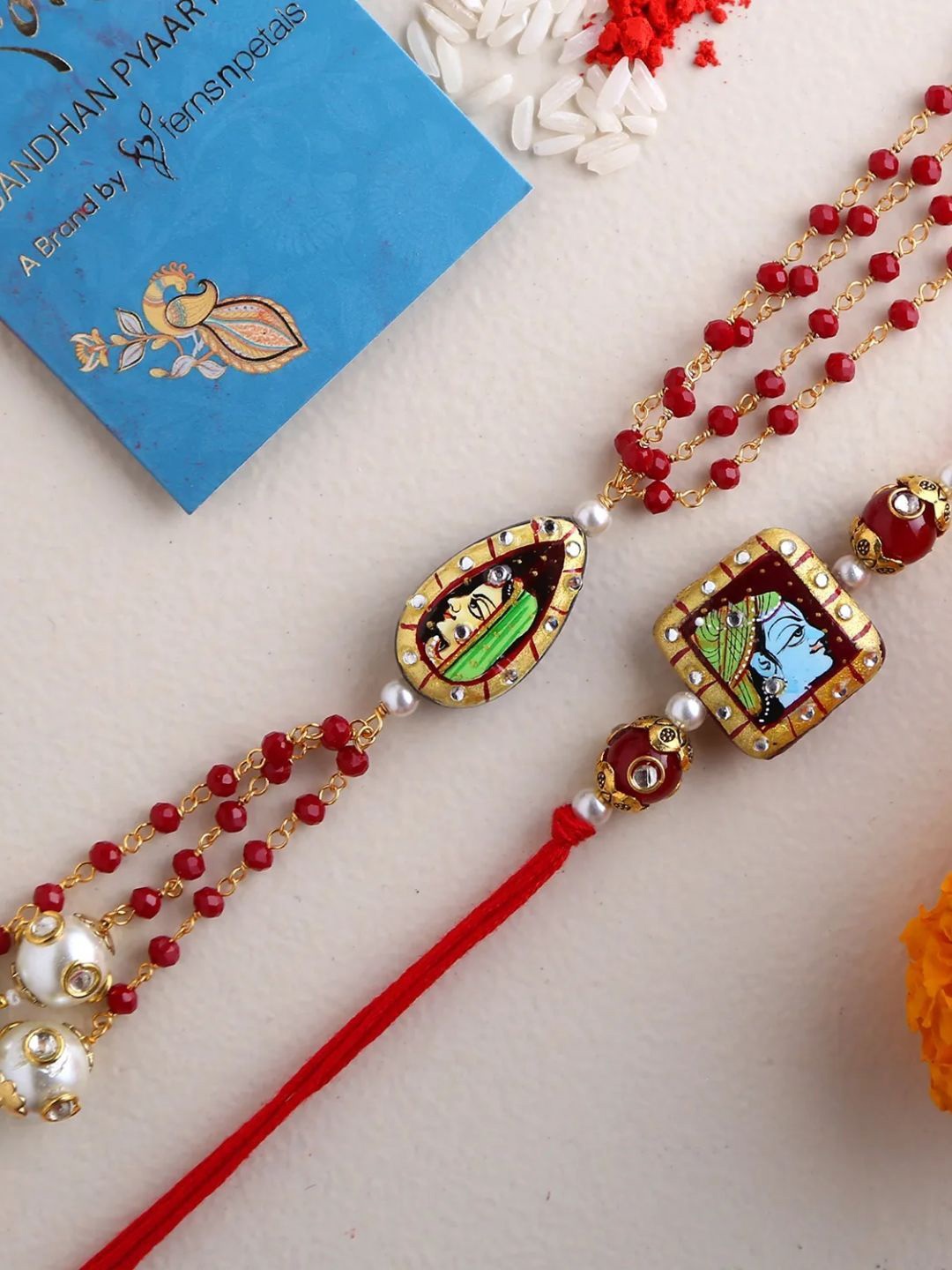 

fnp Radha Krishna Set of 2 Pretty Rakhi Traditional Kundan, Red