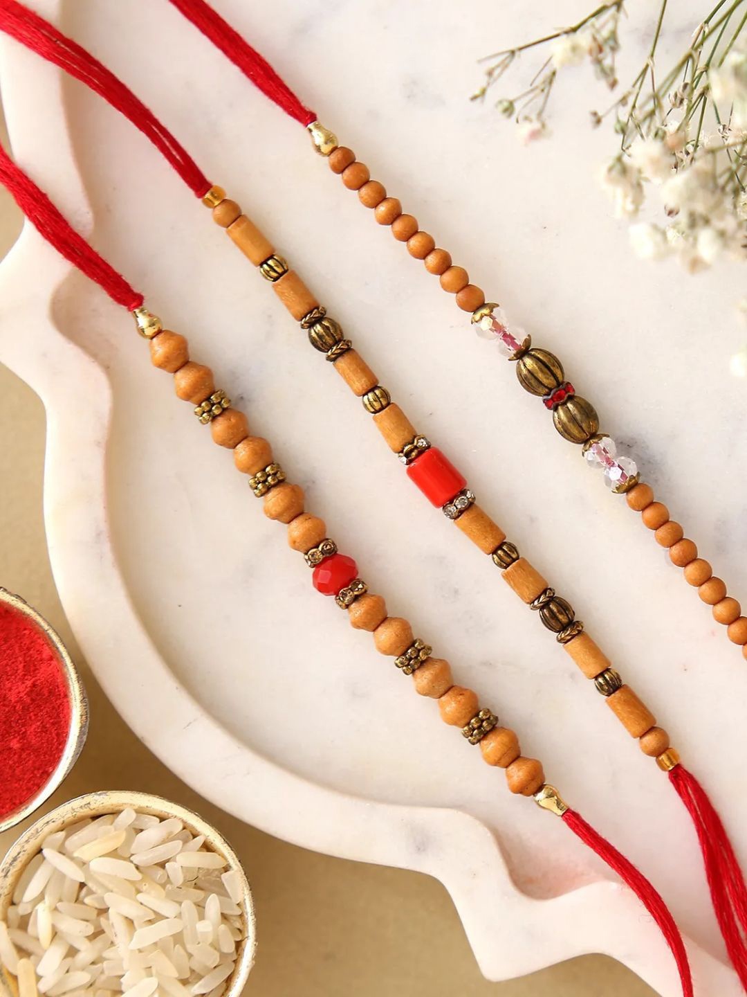 

fnp Sneh Wooden Beads Rakhi Set Of 3 Mauli Rakhis, Red