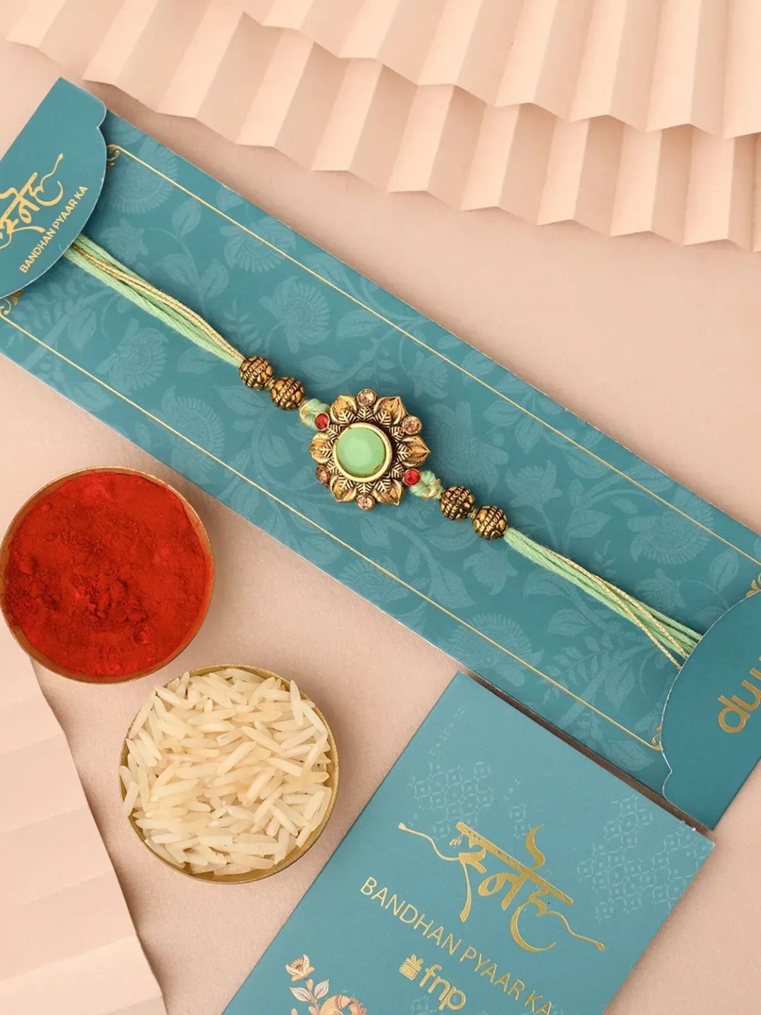 

fnp Rudraksha Rakhi Magical Evil Eye, Green