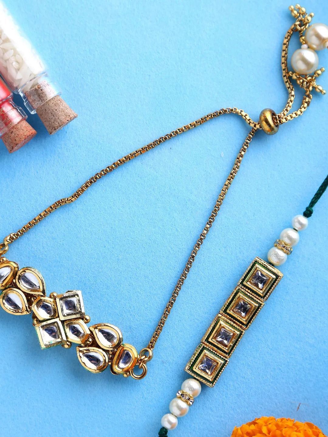 

fnp Blingy Bhaiya Bhabhi Lumba Rakhi Set American Diamond, Gold
