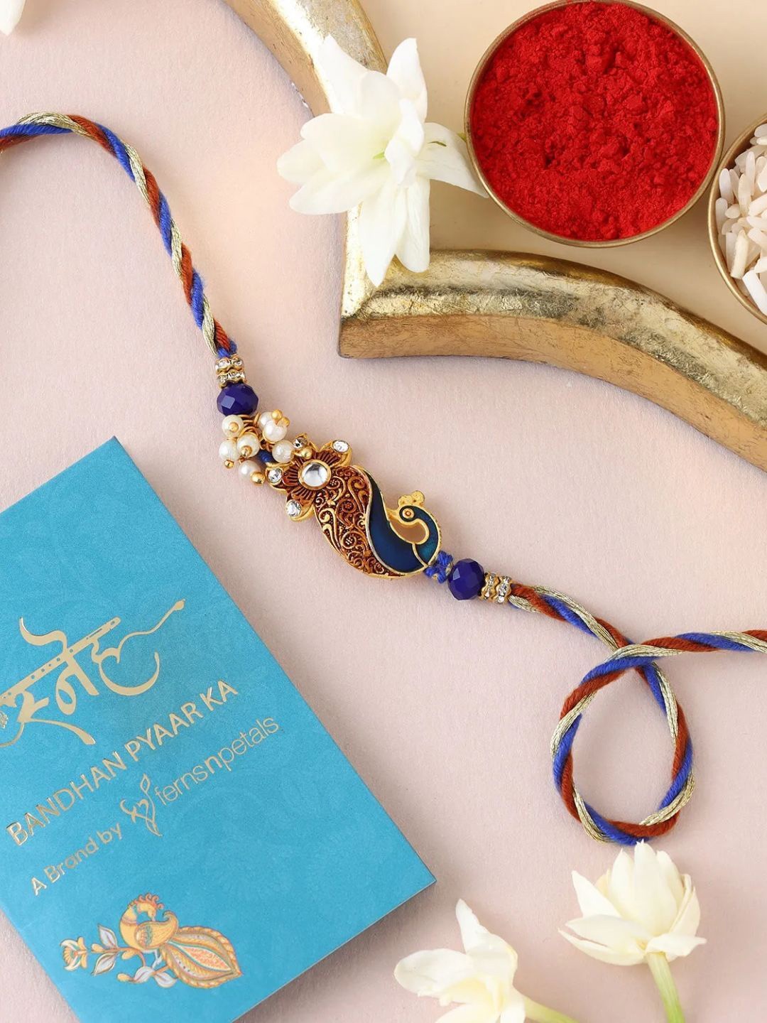 

fnp Graceful Peacock Swirl Rakhi Bracelet Rakhis, Blue