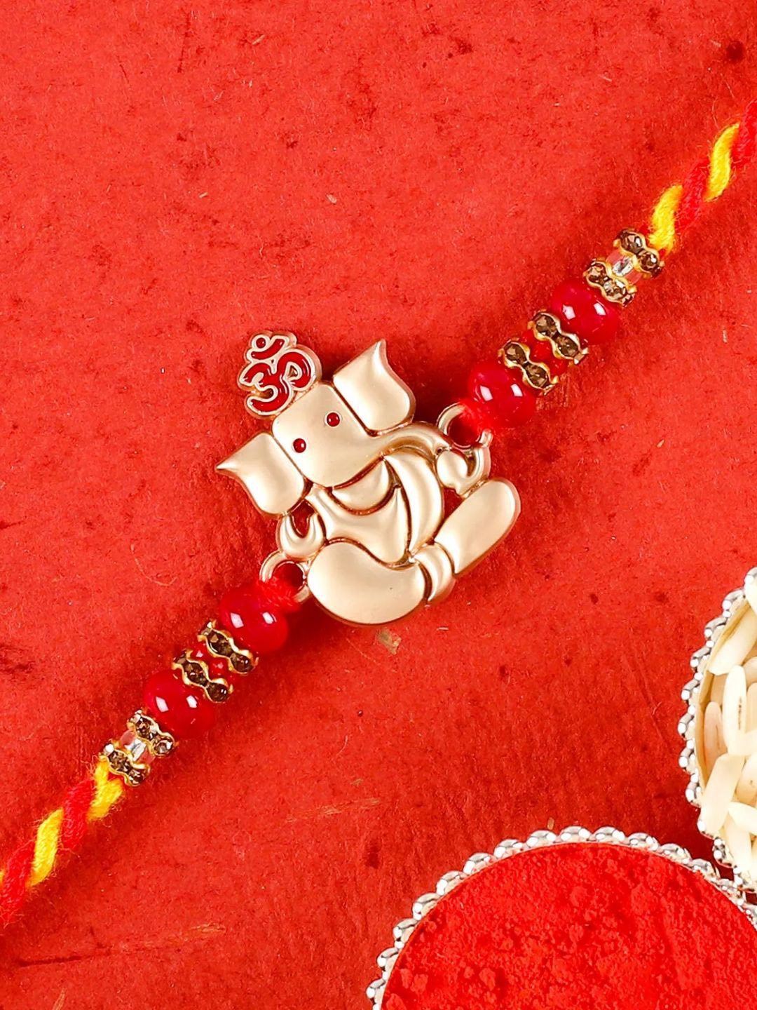 

fnp Religious Lord Ganesha Rakhi Classic Pearls, Red