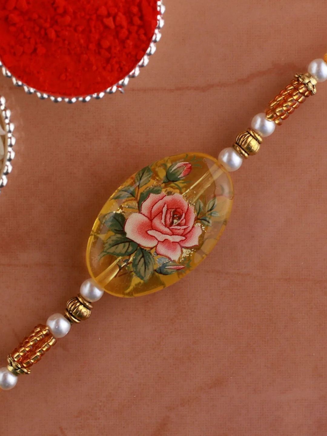 

fnp Pearl Blush Pink Rose Rakhi American Diamond, Gold