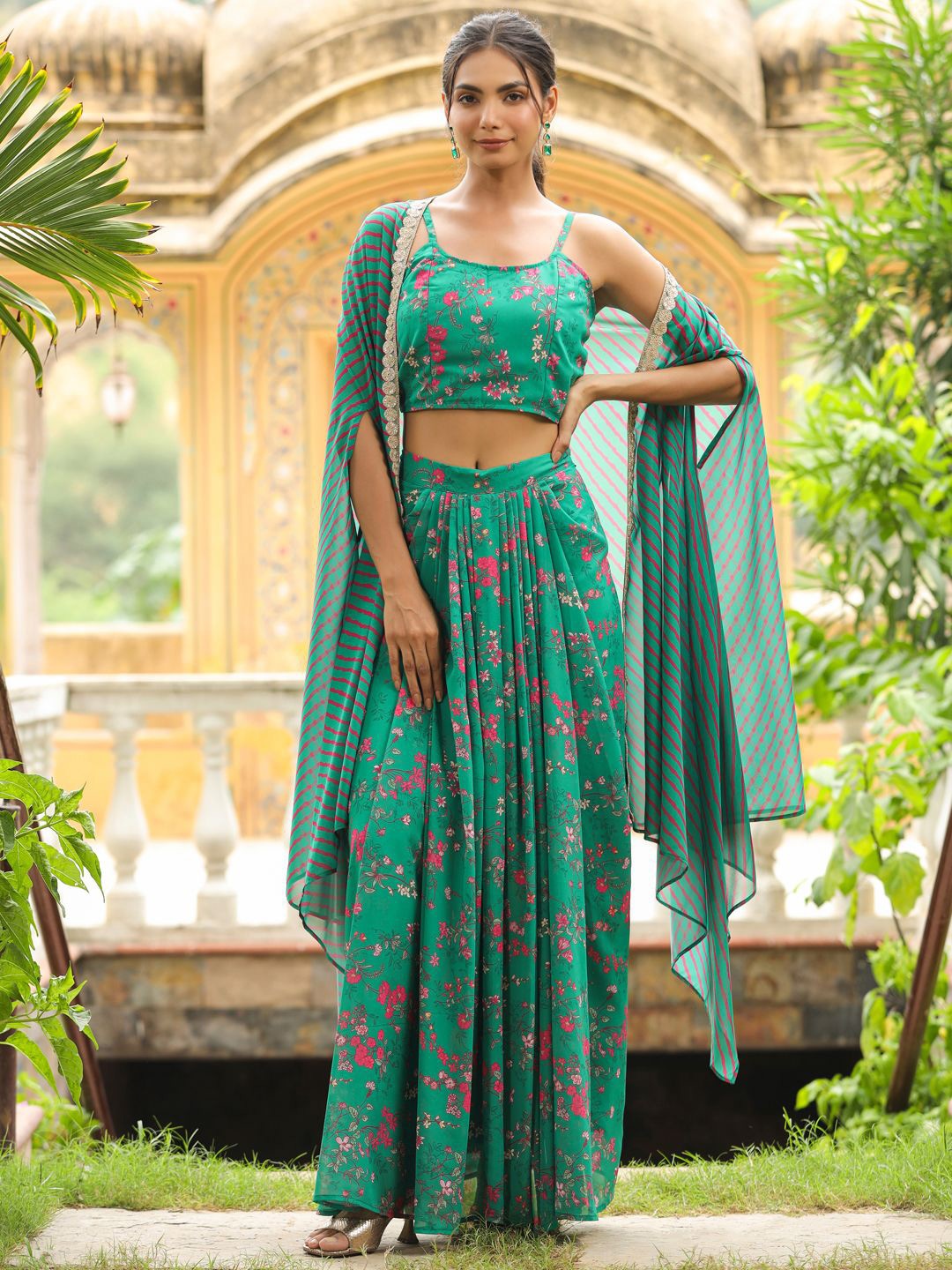 

Janasya Women's Green Georgette Floral Printed Pleated Skirt With Top & Cape Set
