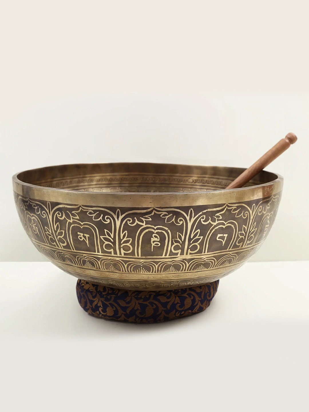 

Exotic India Large Superfine Tibetan Buddhist Singing Bowl with the Image of Om Buddha, Gold