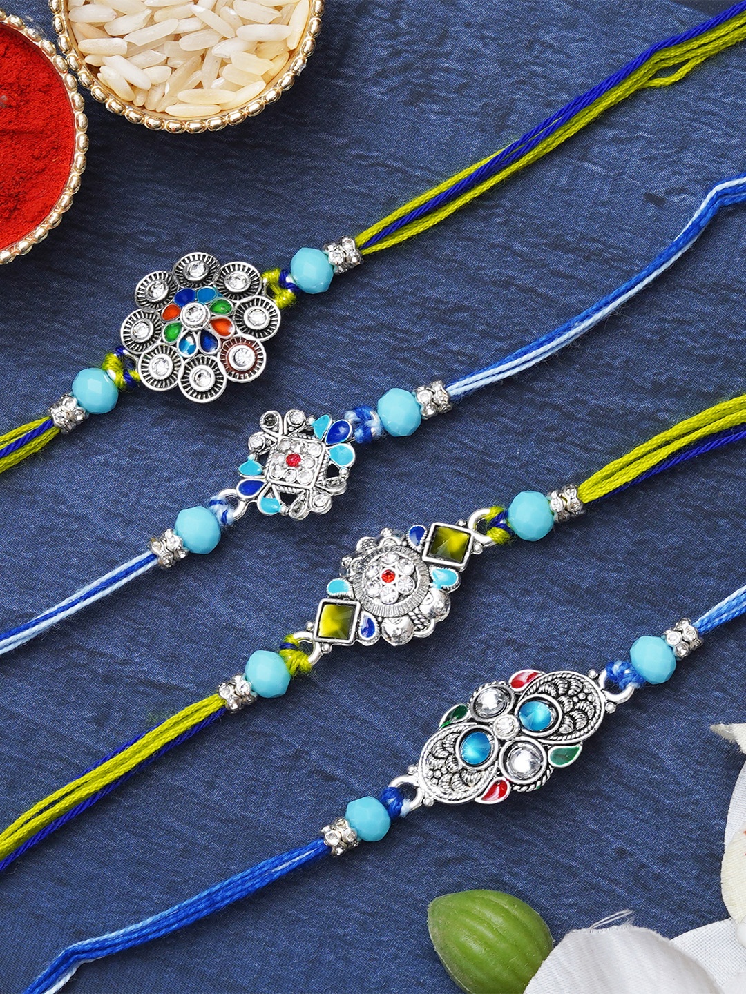 

eCraftIndia Set of 4 Floral Shaped Kundan-Studded Designer Rakhis with Roli & Chawal, Blue