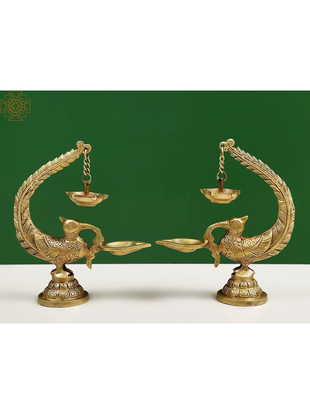 

Exotic India 8" Brass Pair of Peacock Lamp with Five Wicks Diya Hanging on Peacock's Tail, Gold