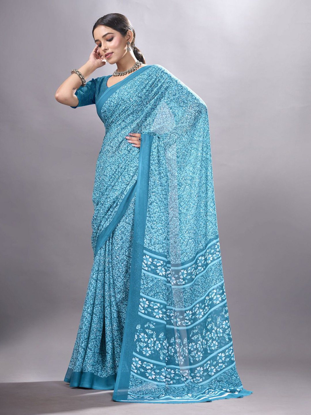 

NIRMAL CREATION Floral Printed Saree, Turquoise blue