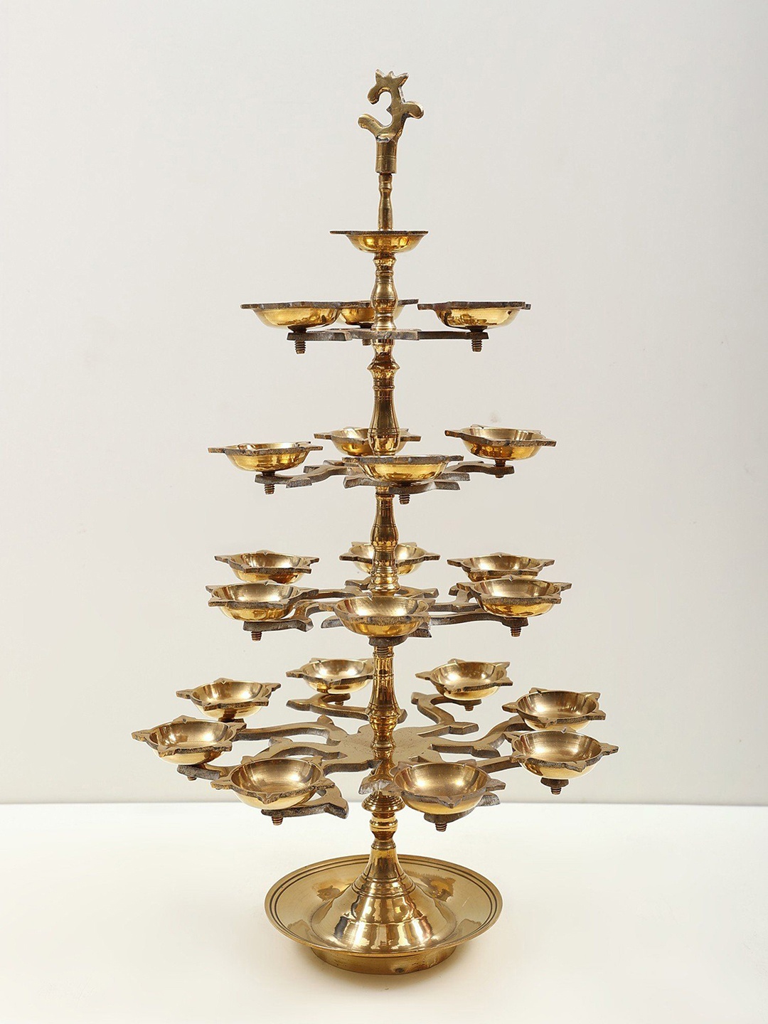 

Exotic India 19" Brass OM Mounted Multi Wick Lamp, Gold