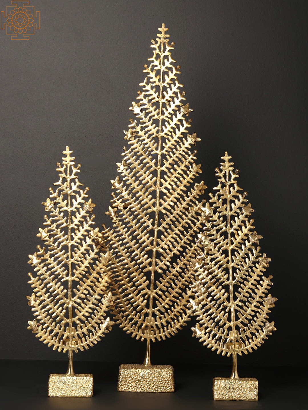 

Exotic India Gold Toned 3 Pieces Brass Christmas Trees With Candle Holder