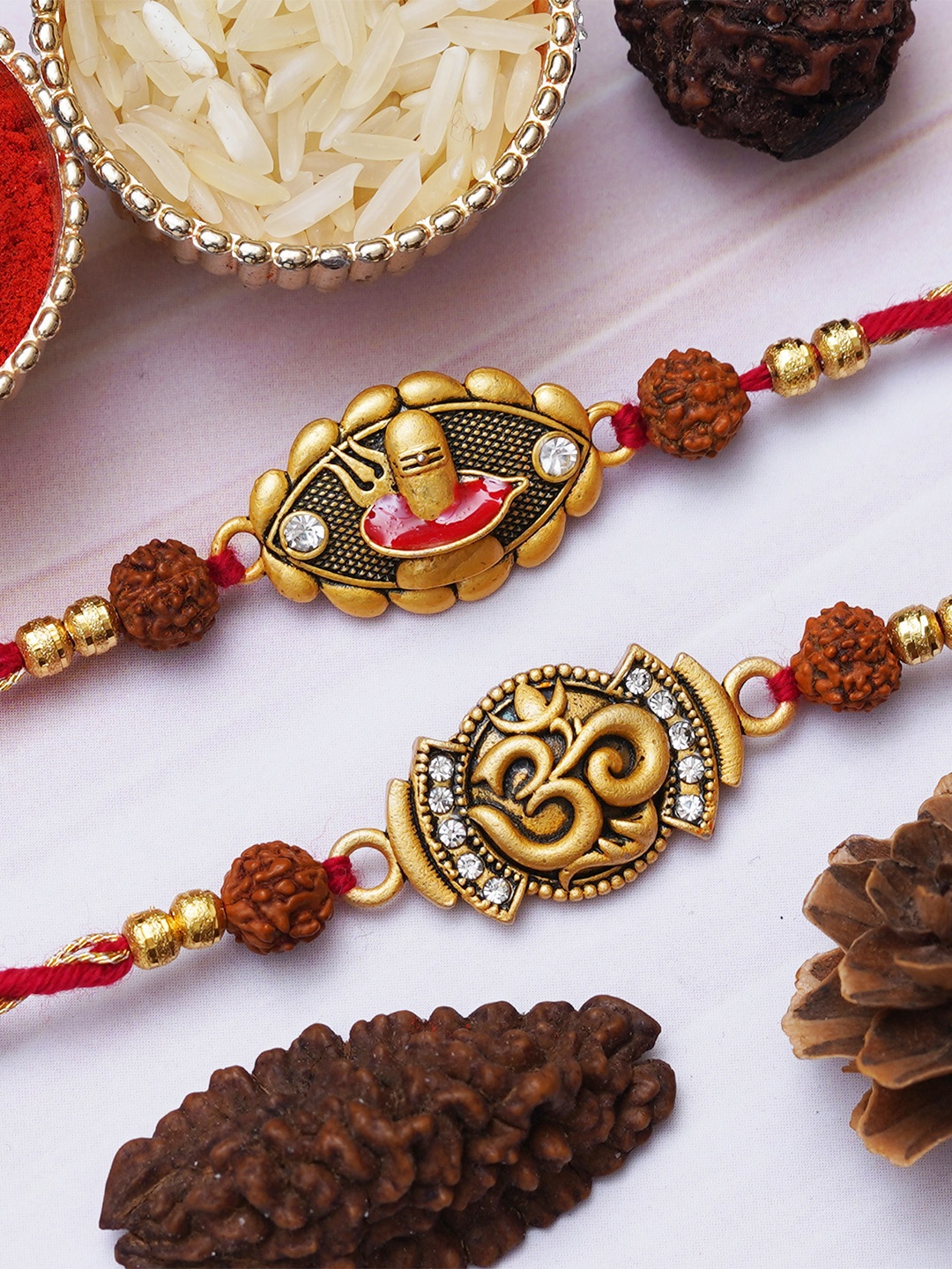 

eCraftIndia Set of 2 Shivalinga Trishul & Om Symbol Rakhis With Roli Chawal, Gold