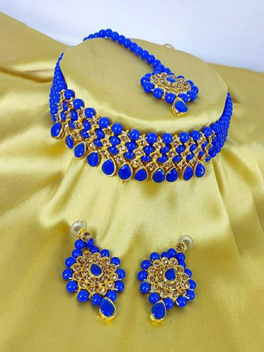 

Gyaan Jewels Artificial Stones and Beads Studded & Beaded Jewellery Set, Gold