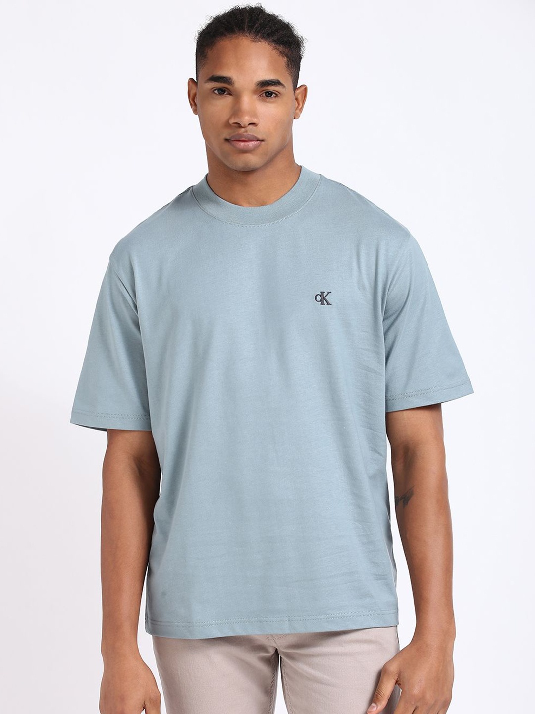 

Calvin Klein Jeans Men Solid Round Neck Cotton Relaxed Fit T-shirt, Blue